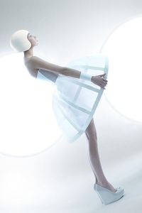 futuristic avant garde couture design - the translucent mini hoop skirt accenting the cage like structure and the matching smooth minimalist helmet and boots  is the unique work of photographers and stylists: alexandra zaharov and ilya plotnikova -  pinned by RokStarroad.com