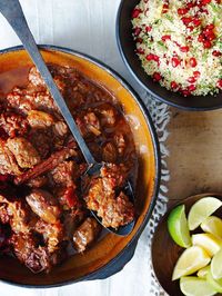 This fragrant lamb and date tagine is flavoured with coriander, cumin, cinnamon and ginger and served with pomegranate couscous.