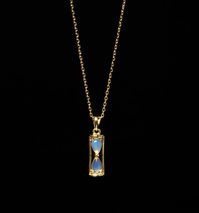 This elegant 15mm Hourglass necklace is presented with a minimalist design, classy and elegant, on a 1.0mm 18K gold plated Sterling silver chain. Hourglasses were an early dependable and accurate measure of time. The rate of flow of the sand is independent of the depth in the upper reservoir, and the instrument will not freeze in cold weather. From the 15th century onwards, hourglasses were being used in a range of applications at sea, in the church, in industry, and in cookery. This necklace br