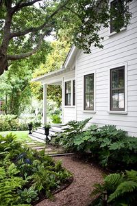 Side garden of a white farmhouse