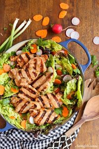 This Grilled Asian Pork Tenderloin Salad is so fresh, flavorful and healthy. It's made with greens and a bright honey-ginger vinaigrette. #porktenderloin #asianpork #asiansalad #saladrecipe #porkrecipe #dinnersalad #porktenderloinrecipe #asiandinnerrecipe