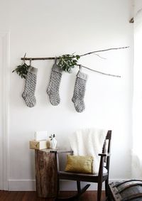 hang your stockings on a branch placed placed on mantle to avoid nails