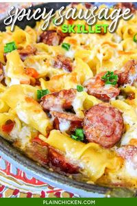 One-Pot Spicy Sausage Skillet - smoked sausage, chicken broth, cream, pasta, Rotel, cheese, and green onions. Everything cooks in the same skillet, even the pasta! Super quick weeknight recipe! Ready in 15 minutes! My husband asked for this pasta 2 days in a row! #pasta #sausage #