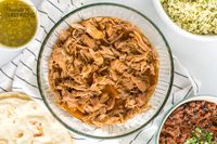 This Cafe Rio Sweet Pork Copycat Recipe is the real deal. The pork is marinated and slow-cooked to perfection in some surprising ingredients! #sweetpork #sweetporkrecipe #caferiorecipe #caferiosweetpork #porkrecipe #shreddedpork #shreddedporkrecipe #sweetporkburrito