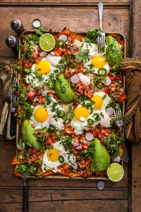 Loaded Red Chilaquiles with Fried Eggs, Fresh Pico, and Chili-Spiked Sour Cream