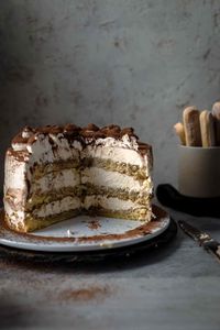 This Tiramisu Cake is made of genoise cake layers brushed with espresso and filled with irresistibly creamy coffee mascarpone cream. There are no raw eggs in the frosting and is therefore safe to eat. All you need are just 10 ingredients.