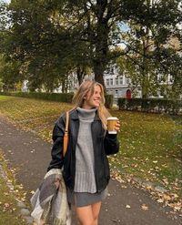 Fall fashion, fall outfit, black leather jacket, oversized sweater, grey mini skirt, mini skirt, scarf, pose, street style, matilda djerf style, instagram, style, fashion, fall style, coffee outfit