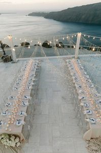 From the Daisies Photography, santorini greece wedding, santorini elopement, all white wedding, destination wedding locations, destination wedding ideas, swan wedding, greece wedding aesthetic, all white aesthetic, cherry wedding cake, sea inspired wedding, classic wedding inspiration, unique wedding dresses, destination elopement ideas, Rocabella Santorini wedding, bride and groom pose ideas, wedding pose ideas, calla lily wedding bouquet, pearl wedding aesthetic