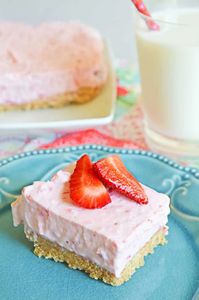 No-bake strawberry cheesecake bars are cool, creamy, and easy to make with fresh strawberries, cream cheese, and Cool Whip.