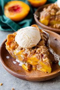 Homemade peach crumble pie is made with sweet brown sugar and warm cinnamon spice. Top each slice of brown sugar peach crumble pie with vanilla ice cream!