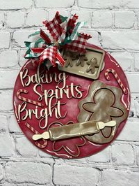 This is a blank kit of an adorable "Baking Spirits Bright" gingerbread door hanger.  The kit includes all blank pieces needed to assemble and personalize your door hanger at home.  Our kits do not come with any paint or glue.  You may personalize with your own colors for a great home decor craft! Item is made from 1/8 INCH MDF. COMES UNFINISHED, NOT SANDED, AND UNASSEMBLED!  FINISHED PRODUCT IN PICTURE IS FOR DISPLAY PURPOSES ONLY. (DECOR AND STAGING ITEMS ALSO NOT INCLUDED)