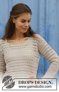 Crocheted sweater with lace pattern. Sizes S - XXXL. The piece is worked in DROPS Cotton Light.