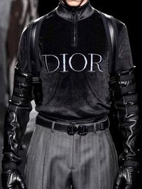 This men's outfit impresses with the mixture of classic trousers and absolutely cool Sweater in a velvet leather mix. Seen at Dior men's runway fashion show. #designerclothing #men #mensfahion #menstyle #coolfashion #fashionoutfits