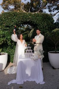 Vic & Hugh pouring their champagne tower at The Fig Tree Byron Bay.