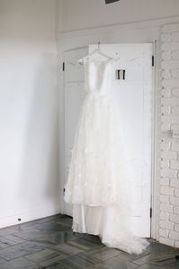 Gorgeous wedding gown hung up in The Dairy accommodation at Fig Tree Restaurant. Photographer - Amelia Fullarton.