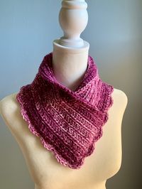 This pull over cowl is handmade and lightweight. Crocheted of marled purple acrylic yarn in a loose knit with plenty of stretch. The bib style has a pretty scallop trim. Roll the neck edge or wear up to keep out the chill. Wear with a sweater as a winter accessory. Great gift idea too. The neutral color works for men or women.