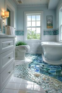 Tidal pool mosaic tiles offer a unique and intricate flooring or wall option for coastal theme bathroom decor, mimicking the colorful and diverse environment of tidal pools. These mosaics can include shades of blues, greens, and earth tones, interspersed with bright colors that represent marine life. The tiles not only add visual interest and texture but also have a practical, water-resistant surface ideal for bathrooms. Tidal pool designs can make the bathroom feel like an extension of the sea, enhancing the immersive coastal experience. Mosaic tiles are a durable and artistic way to incorporate coastal themes into bathroom design. Tap to explore more tidal pool mosaic tile designs for your bathroom.