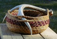 Pine needle basket with antler handle.