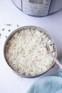 Instant Pot pot-in-pot rice is a great way to prepare rice along with the entree for a one-pot complete meal. The pot-in-pot method saves time and let's you make a complete meal at once. Here is a step-by-step guide to cooking PIP rice in your pressure cooker.