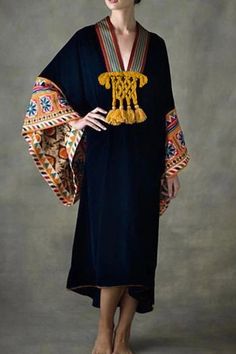 This vintage-inspired kaftan features a V-neck, batwing sleeves, and a high waist. With its ethnic pattern and flowing silhouette, it's perfect for a stylish, relaxed look. Details: Elasticity: Slight Stretch Fabric Type: POLYESTER Neckline: V-Neck Material: COTTON Material: POLYESTER Material: Velvet Size (IN) Length M 46.26 L 46.85 XL 47.44 XXL 48.03 XXXL 48.62 4XL 49.21 Folk Style V-neck Kaftan For Festival, Black Kaftan For Eid, Black Long Sleeve Festival Kaftan, Bohemian Black Kaftan For Eid, Black Bohemian Kaftan For Eid, Traditional Black Dress With Kimono Sleeves, Bohemian V-neck Kaftan For Eid, Traditional Black Free Size Kaftan, Black Tunic Kaftan For Festival