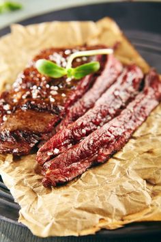 some meat sitting on top of a piece of wax paper