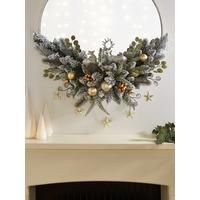 a fireplace mantel decorated with christmas decorations