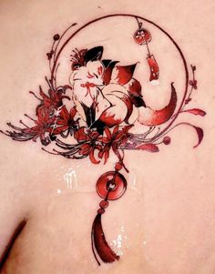 a woman's back tattoo with flowers and leaves on her left side breast area