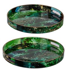 two green and black trays sitting on top of each other