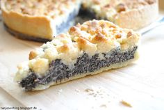 a piece of pie sitting on top of a wooden cutting board