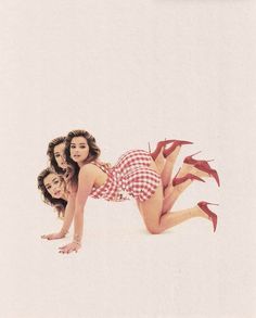 two women are laying on the ground with red shoes in front of their backs and legs