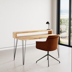 a desk with a chair next to it in front of a window