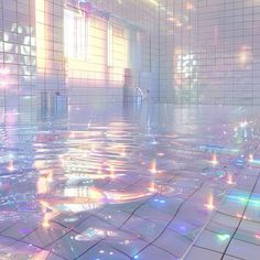 the floor is covered in water and colorful lights