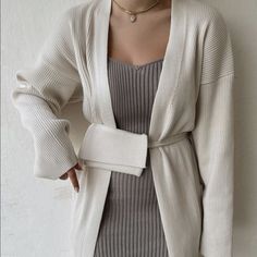 Open Coat With Long Sleeves. Tie Belt With Detachable Little Bag In The Same Fabric. Outer Shell 52% Viscose 26% Polyester 22% Nylon Chic Beige Ribbed Outerwear, Elegant Ribbed Winter Outerwear, Elegant Ribbed Outerwear For Spring, Elegant Ribbed Spring Outerwear, Elegant Beige Ribbed Outerwear, Elegant Ribbed Beige Outerwear, Elegant Long Sleeve Ribbed Outerwear, Elegant Ribbed Long Sleeve Outerwear, Chic White Ribbed Outerwear