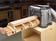 a workbench is being built in a woodworking shop