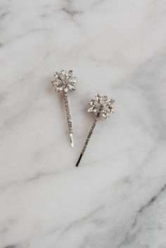 Monroe Hair Pins These crystal bridal bobby pins feature rhinestone crystals reminiscent of the art deco era. These pins tuck into any bridal hairstyle and are the perfect accessory for your bridesmaids, too. Price is for a set of two. Dimensions: Decorative section of each pin is approximately 1" x 1". Each order is thoughtfully gift wrapped and shipped in a gold embossed Luna + Stone branded keepsake box. These boxes are perfect for gifting and storing your accessories long after your big day. Clip Wedding Hair, Hair Clip Wedding, Crystal Hair Clip, Silver Earrings Wedding, Hair Pins Bridal, Wedding Barrettes, Crystal Hair Clips, Crystal Hair Pins, Bridal Hairstyle