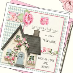 a card with a house and flowers on it