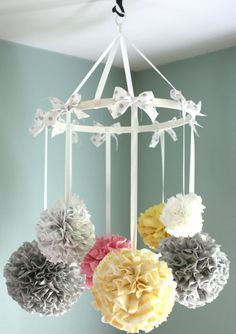 an image of a mobile phone with paper flowers hanging from it