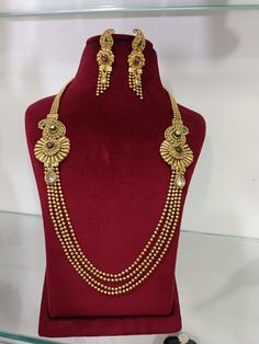 Polki Long Necklace Earrings Jewelry Set/ Gold Plated Designer Kundan Ruby Wedding Necklace Earrings/ Bridal Wedding Jewellery Set ITEM DESCRIPTION Metal        = Gold Plated Occasion  = Wedding, Party Wear, Bridal Color        = Gold and Green/Red Size          = Necklace Length = 10 Inches Long, Earring Size = 2 Inches Long,  Free Shipping 100% Satisfaction Guarantee: 1 Year Warranty, Long Lasting Plating, High-Quality Stones Occasion: Perfect choice for any Indian occasion.  Care: It is advisable that you keep products away from direct heat, humidity, and moisture. It is best to preserve your jewelry in the box. Keep Away From Water, Spray And Perfumes For Better Look. Happy Buying :) Gold Hand-set Bridal Earrings For Wedding, Gold Hand Set Bridal Earrings For Wedding, Yellow Gold Jewelry Sets With Matching Earrings For Wedding, Chandbali Jewelry With Elegant Design For Wedding, Festive Gold Bridal Necklace With Matching Earrings, Elegant Chandbali Jewelry For Wedding, Elegant Chandbali Wedding Jewelry, Gold Plated Dangle Jewelry Sets For Weddings, Gold Earrings With Intricate Design For Wedding