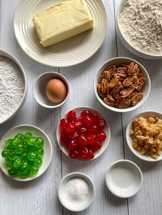 the ingredients are laid out on the table to be used for making desserts, including pecans, cranberries, and walnuts