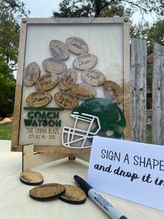 a wooden sign that has been made to look like a football helmet and some other items