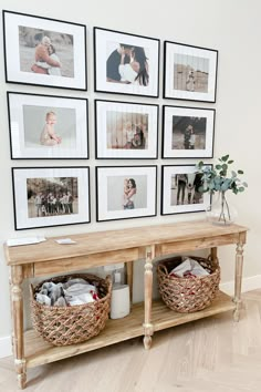 a wooden table topped with pictures and baskets