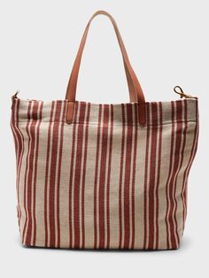 A sturdy canvas tote made to carry the essentials and then some.  Leather handles.  Hanging slip pocket inside.  Fully lined.  Height: 16" (41cm) Width: 13. 4" (34cm) Depth: 4. 75" (12cm) Canvas Hobo Bag With Pockets For Errands, Casual Hobo Tote Bag With Canvas Lining, Cotton Weekender Bag With Adjustable Strap And Tote Shape, Cotton Weekender Bag With Adjustable Strap, Casual Everyday Satchel With Canvas Lining, Canvas Tote Satchel With Canvas Lining, Everyday Hobo Bag With Canvas Lining In Tote Shape, Everyday Tote Hobo Bag With Canvas Lining, Everyday Hobo Bag With Canvas Lining