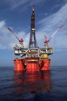 an oil rig in the middle of the ocean