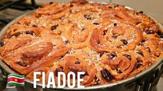 a close up of a pie in a pan on a stove with the words fadoe above it