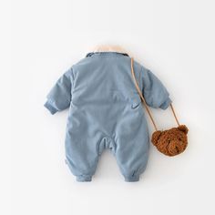 Introducing the Corduroy Fur Turn Down Romper—the perfect winter outfit for your little one! Made from soft and cozy cotton, this romper is designed to keep your baby warm and comfortable during the colder months. With its adorable animal pattern and stylish turn-down collar, it's perfect for both baby boys and girls. The single-breasted closure makes dressing a breeze, while the long sleeves provide extra warmth. Available in a charming blue color, this romper is as cute as it is functional. Ge Winter Cotton Onesie, Casual Jumpsuits And Rompers For Winter Playtime, Long Sleeve Onesie For Winter Playtime, Long Sleeve Onesie For Playtime In Winter, Winter Cotton Bubble Romper For Playtime, Cotton Bubble Romper For Winter Playtime, Winter Long Sleeve Bubble Romper For Playtime, Blue Long Sleeve Jumpsuits And Rompers For Playtime, Winter Cotton Bubble Romper With Long Sleeves