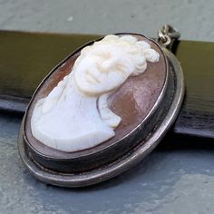 We take pride in finding unique , quality ~ Antique /Vintage jewelry pieces which are carefully hand picked by us so that you can add them to your treasure/ collection or gift to someone you love ~ We try to add plenty of items every week and have been selling online for more then 10 years . Antique Victorian ~ sterling silver ~ deeply hand carved cameo ~ pendant ~ Just add chain and its ready to wear . Marked 800 for silver Dates late 19th to early 20th century Materials : 800 silver shell came Antique Silver Cameo Jewelry, Classic Cameo Oval Pendant Jewelry, Silver Cameo Oval Pendant Jewelry, Silver Cameo Pendant Necklace, Collectible Cameo Pendant Brooches, Cameo Jewelry, Cameo Pendant, Jewelry Pieces, Hand Carved