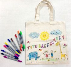 a tote bag with crayons and markers on it