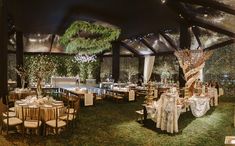 an indoor wedding venue with tables and chairs set up for a formal function at night