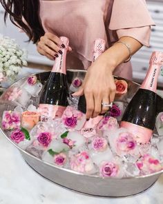 two pictures one is champagne and the other has flowers in ice with straws on them