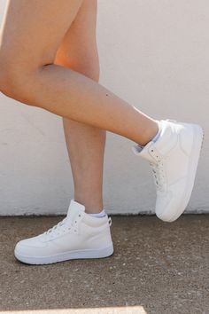 Upgrade your sneaker game with our STEP UP MIDTOP SNEAKERS. Designed for both style and comfort, these sneakers offer a modern mid-top design paired with all-around support. Perfect for any occasion, these sneakers will elevate your outfit while keeping your feet happy. Elevate Your Outfit, Sneaker Games, Mid Top, Your Outfit, Top Design, Step Up, Tops Designs, Sneakers, White